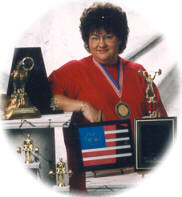 Nancy Nutt - Bench Press Champion with some of her hardware.